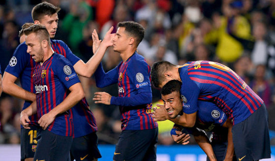 Barcelona's Brazilian midfielder Rafinha (2R) celebrates with teammates after scoring during the UEFA Champions League group B match Barcelona against Inter Milan at the Camp Nou stadium in Barcelona on October 24, 2018. (Photo by Josep LAGO / AFP) (Photo credit should read JOSEP LAGO/AFP/Getty Images)
