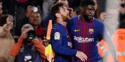 Barcelona's Argentinian forward Lionel Messi (L) celebrates a goal with Barcelona's French defender Samuel Umtiti during the Spanish league football match between FC Barcelona and Deportivo Alaves at the Camp Nou stadium in Barcelona on January 28, 2018. / AFP PHOTO / Josep LAGO (Photo credit should read JOSEP LAGO/AFP/Getty Images