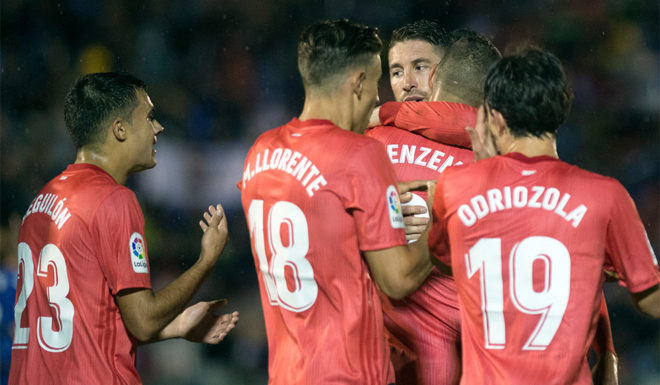 Real Madrid's Spanish defender Sergio Ramos (C) congratulates Real Madrid's French forward Karim Benzema (2R) for his goal during the Spanish King's Cup (Copa del Rey) football match between UD Melilla and Real Madrid CF at the Alvarez Claro municipal stadium in the autonomous city of Melilla on October 31, 2018. (Photo by JORGE GUERRERO / AFP) (Photo credit should read JORGE GUERRERO/AFP/Getty Images)