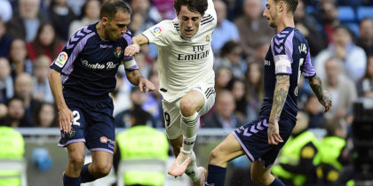 Real Madrid's Spanish defender Alvaro Odriozola (C) vies with Real Valladolid's Spanish defender Nacho (L) and Real Valladolid's Spanish defender Fernando Calero during the Spanish league football match between Real Madrid CF and Real Valladolid FC at the Santiago Bernabeu stadium in Madrid on November 3, 2018. (Photo by JAVIER SORIANO / AFP) (Photo credit should read JAVIER SORIANO/AFP/Getty Images)