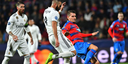 Real Madrid's French forward Karim Benzema and Viktoria Plzen's Czech defender Lukas Hejda vie for the ball during the UEFA Champions League group G football match Viktoria Plzen v Real Madrid in Plzen, Czech Republic on November 7, 2018. (Photo by JOE KLAMAR / AFP) (Photo credit should read JOE KLAMAR/AFP/Getty Images)