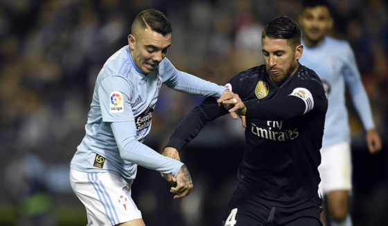 Celta Vigo's Spanish forward Iago Aspas (L) vies with Real Madrid's Spanish defender Sergio Ramos during the Spanish league football match between RC Celta de Vigo and Real Madrid CF at the Balaidos stadium in Vigo on November 11, 2018. (Photo by MIGUEL RIOPA / AFP) (Photo credit should read MIGUEL RIOPA/AFP/Getty Images)