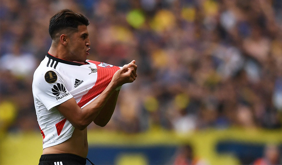 River Plate's Exequiel Palacios celebrates after teammate Lucas Pratto (out of frame) scored their team's first goal against Boca Juniors, during their first leg match of the all-Argentine Copa Libertadores final, at La Bombonera stadium in Buenos Aires, on November 11, 2018. - River Plate twice came from behind to snatch a 2-2 draw with fierce rivals Boca Juniors in first leg of their weather-delayed 'Superclasico' Copa Libertadores final on Sunday. (Photo by Eitan ABRAMOVICH / AFP) (Photo credit should read EITAN ABRAMOVICH/AFP/Getty Images)