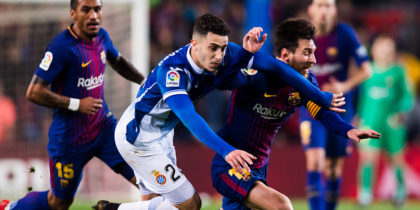BARCELONA, SPAIN - JANUARY 25: Lionel Messi of FC Barcelona fights for the ball with Mario Hermoso of RCD Espanyol during the Spanish Copa del Rey Quarter Final Second Leg match between FC Barcelona and RCD Espanyol at Camp Nou stadium at Camp Nou on January 25, 2018 in Barcelona, Spain. (Photo by Alex Caparros/Getty Images)
