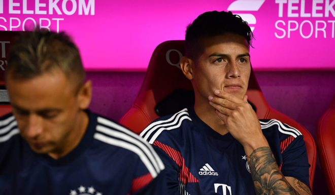 MUNICH, GERMANY - AUGUST 24: James Rodriguez of Bayern Muenchen sits on the bench during the Bundesliga match between FC Bayern Muenchen and TSG 1899 Hoffenheim at Allianz Arena on August 24, 2018 in Munich, Germany. (Photo by Sebastian Widmann/Bongarts/Getty Images)
