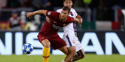 ROME, ITALY - OCTOBER 23: Edin Dzeko of AS Roma competes for the ball with IIzat AKhmetov of CSKA Moscow during the Group G match of the UEFA Champions League between AS Roma and CSKA Moscow at Stadio Olimpico on October 23, 2018 in Rome, Italy. (Photo by Paolo Bruno/Getty Images)