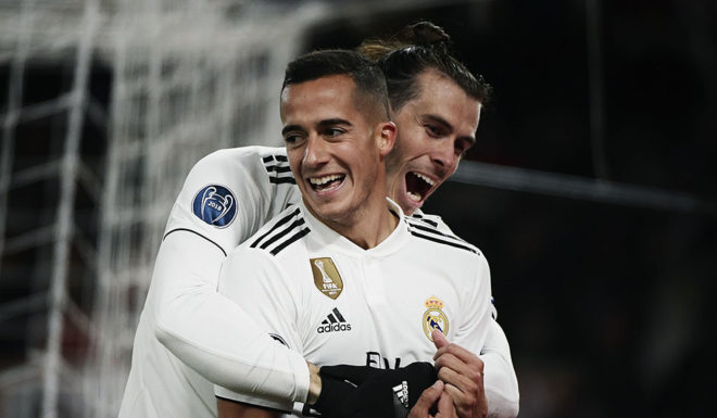 Real Madrid's Welsh forward Gareth Bale (Rear) and Real Madrid's Spanish midfielder Lucas Vazquez celebrate after Vazquez scored 0-2 during the UEFA Champions League group G football match AS Rome vs Real Madrid on November 27, 2018 at the Olympic stadium in Rome. (Photo by Filippo MONTEFORTE / AFP) (Photo credit should read FILIPPO MONTEFORTE/AFP/Getty Images)