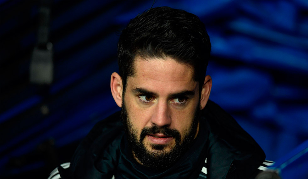 Real Madrid's Spanish midfielder Isco arrives to sit on the bench during the Spanish league football match between Real Madrid and Valencia at the Santiago Bernabeu stadium in Madrid on December 1, 2018. (Photo by OSCAR DEL POZO / AFP) (Photo credit should read OSCAR DEL POZO/AFP/Getty Images)