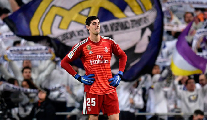 Real Madrid's Belgian goalkeeper Thibaut Courtois reacts during the Spanish league football match between Real Madrid and Valencia at the Santiago Bernabeu stadium in Madrid on December 1, 2018. (Photo by OSCAR DEL POZO / AFP) (Photo credit should read OSCAR DEL POZO/AFP/Getty Images)