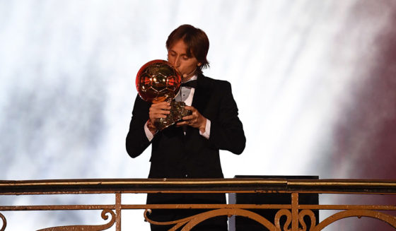 Real Madrid's Croatian midfielder Luka Modric kisses the trophy after receiving the 2018 FIFA Men's Ballon d'Or award for best player of the year during the 2018 FIFA Ballon d'Or award ceremony at the Grand Palais in Paris on December 3, 2018. - The winner of the 2018 Ballon d'Or will be revealed at a glittering ceremony in Paris on December 3 evening, with Croatia's Luka Modric and a host of French World Cup winners all hoping to finally end the 10-year duopoly of Cristiano Ronaldo and Lionel Messi. (Photo by FRANCK FIFE / AFP) (Photo credit should read FRANCK FIFE/AFP/Getty Images)