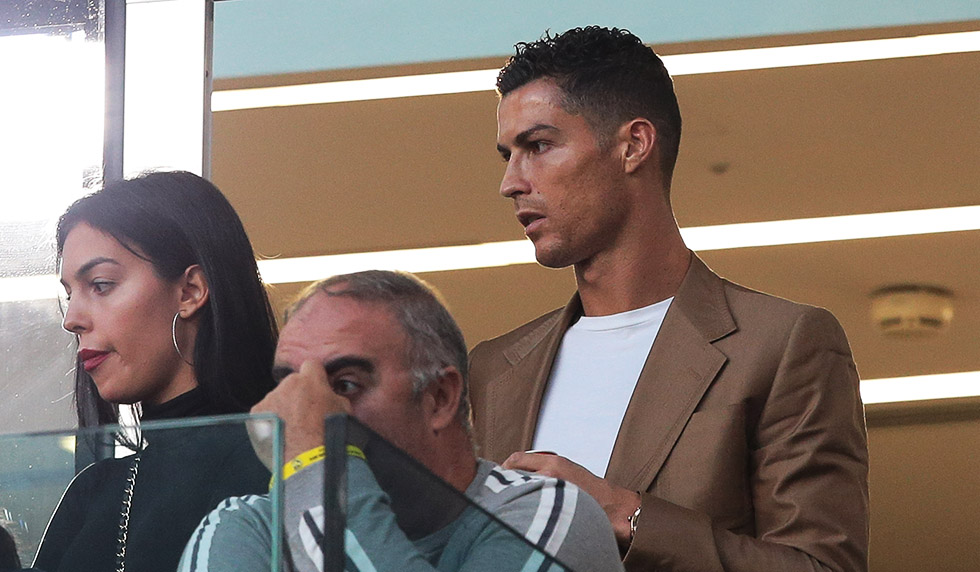 TURIN, ITALY - OCTOBER 02: Cristiano Ronaldo and Georgina Rodriguez are seen during the Group H match of the UEFA Champions League between Juventus and BSC Young Boys at Allianz Stadium on October 2, 2018 in Turin, Italy. (Photo by Emilio Andreoli/Getty Images)