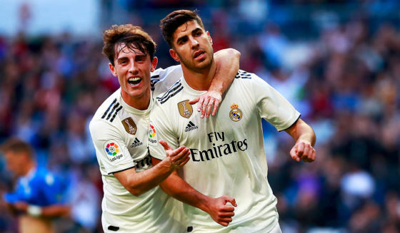 MADRID, SPAIN - DECEMBER 06: Marco Asensio of Real Madrid (20) celebrates after scoring his team's first goal with Alvaro Odriozola during the Copa del Rey fourth round match between Real Madrid and Melilla at Estadio Bernabeu on December 6, 2018 in Madrid, Spain. (Photo by Gonzalo Arroyo Moreno/Getty Images)