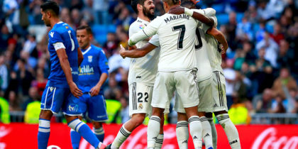 MADRID, SPAIN - DECEMBER 06: Marco Asensio of Real Madrid (obscured) celebrates after scoring his team's second goal with team mates during the Copa del Rey fourth round match between Real Madrid and Melilla at Estadio Bernabeu on December 6, 2018 in Madrid, Spain. (Photo by Gonzalo Arroyo Moreno/Getty Images)