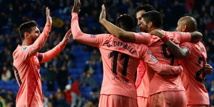 Barcelona's Uruguayan forward Luis Suarez (2R) celebrates with teammates after scoring during the Spanish league football match RCD Espanyol against FC Barcelona at the RCDE Stadium in Cornella de Llobregat on December 8, 2018. (Photo by PAU BARRENA / AFP) (Photo credit should read PAU BARRENA/AFP/Getty Images)