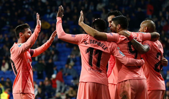 Barcelona's Uruguayan forward Luis Suarez (2R) celebrates with teammates after scoring during the Spanish league football match RCD Espanyol against FC Barcelona at the RCDE Stadium in Cornella de Llobregat on December 8, 2018. (Photo by PAU BARRENA / AFP) (Photo credit should read PAU BARRENA/AFP/Getty Images)