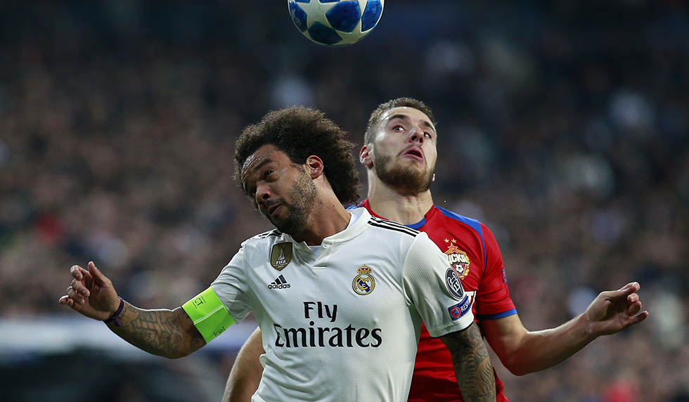 MADRID, SPAIN - DECEMBER 12: Nikola Vlasic of CSKA Moscow competes for a header with Marcelo of Real Madrid during the UEFA Champions League Group G match between Real Madrid and CSKA Moscow at Bernabeu on December 12, 2018 in Madrid, Spain. (Photo by Gonzalo Arroyo Moreno/Getty Images)