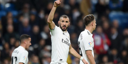 MADRID, SPAIN - DECEMBER 15: Karim Benzema of Real Madrid celebrates after scoring his team's first goal during the La Liga match between Real Madrid CF and Rayo Vallecano de Madrid at Estadio Santiago Bernabeu on December 15, 2018 in Madrid, Spain. (Photo by Denis Doyle/Getty Images)