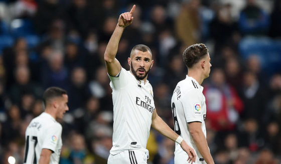 MADRID, SPAIN - DECEMBER 15: Karim Benzema of Real Madrid celebrates after scoring his team's first goal during the La Liga match between Real Madrid CF and Rayo Vallecano de Madrid at Estadio Santiago Bernabeu on December 15, 2018 in Madrid, Spain. (Photo by Denis Doyle/Getty Images)