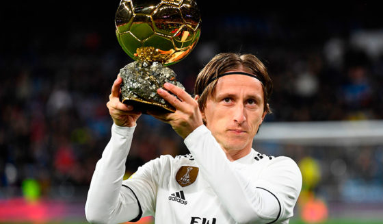 Real Madrid's Croatian midfielder Luka Modric poses with his Ballon d'Or trophy before the Spanish League football match between Real Madrid and Rayo Vallecano at the Santiago Bernabeu stadium in Madrid on December 15, 2018. (Photo by GABRIEL BOUYS / AFP) (Photo credit should read GABRIEL BOUYS/AFP/Getty Images)