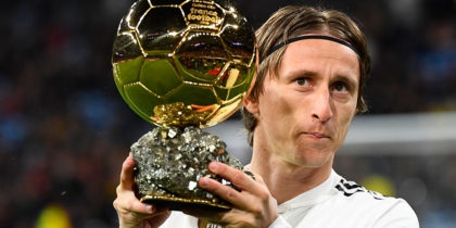 Real Madrid's Croatian midfielder Luka Modric poses with his Ballon d'Or trophy before the Spanish League football match between Real Madrid and Rayo Vallecano at the Santiago Bernabeu stadium in Madrid on December 15, 2018. (Photo by GABRIEL BOUYS / AFP) (Photo credit should read GABRIEL BOUYS/AFP/Getty Images)