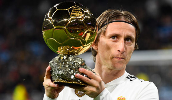 Real Madrid's Croatian midfielder Luka Modric poses with his Ballon d'Or trophy before the Spanish League football match between Real Madrid and Rayo Vallecano at the Santiago Bernabeu stadium in Madrid on December 15, 2018. (Photo by GABRIEL BOUYS / AFP) (Photo credit should read GABRIEL BOUYS/AFP/Getty Images)