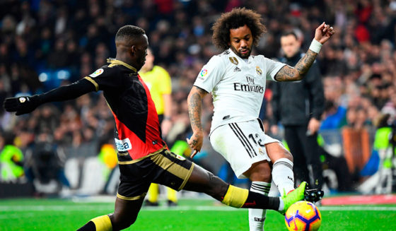 Rayo Vallecano's Peruvian defender Luis Advincula (L) vies with Real Madrid's Brazilian defender Marcelo during the Spanish League football match between Real Madrid and Rayo Vallecano at the Santiago Bernabeu stadium in Madrid on December 15, 2018. (Photo by GABRIEL BOUYS / AFP) (Photo credit should read GABRIEL BOUYS/AFP/Getty Images)