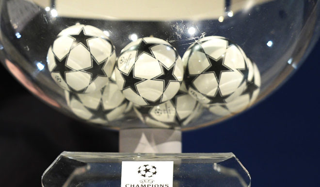 UEFA General Secretary Gianni Infantino stands by the draw balls prior to the draw for the quarter-finals of the UEFA Champions league at the UEFA headquarters in Nyon on March 21, 2014.