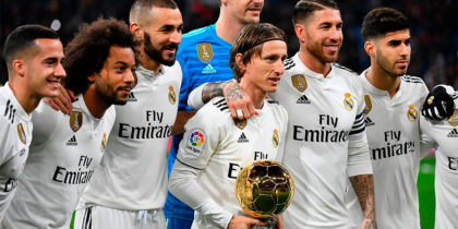 Real Madrid's Croatian midfielder Luka Modric (C) poses with his Ballon d'Or trophy and teammates before the Spanish League football match between Real Madrid and Rayo Vallecano at the Santiago Bernabeu stadium in Madrid on December 15, 2018. (Photo by GABRIEL BOUYS / AFP) (Photo credit should read GABRIEL BOUYS/AFP/Getty Images)