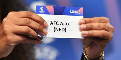Former French football player Laura Georges shows the slip of AFC Ajax during the draw for the round of 16 of the UEFA Champions League football tournament at the UEFA headquarters in Nyon on December 17, 2018. (Photo by Fabrice COFFRINI / AFP) (Photo credit should read FABRICE COFFRINI/AFP/Getty Images)