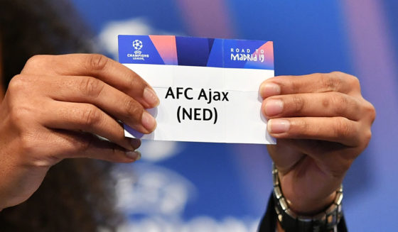 Former French football player Laura Georges shows the slip of AFC Ajax during the draw for the round of 16 of the UEFA Champions League football tournament at the UEFA headquarters in Nyon on December 17, 2018. (Photo by Fabrice COFFRINI / AFP) (Photo credit should read FABRICE COFFRINI/AFP/Getty Images)