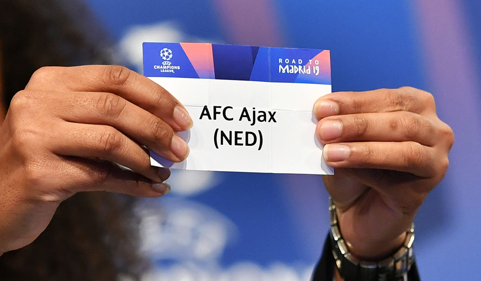 Former French football player Laura Georges shows the slip of AFC Ajax during the draw for the round of 16 of the UEFA Champions League football tournament at the UEFA headquarters in Nyon on December 17, 2018. (Photo by Fabrice COFFRINI / AFP) (Photo credit should read FABRICE COFFRINI/AFP/Getty Images)