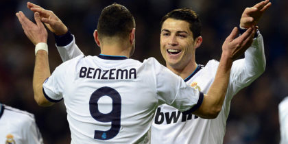 Real Madrid's Portuguese forward Cristiano Ronaldo (R) celebrates with his teammate French forward Karim Benzema after scoring during the UEFA Champions League Group D football match Real Madrid vs Ajax Amsterdam at the Santiago Bernabeu stadium in Madrid on December 4, 2012. AFP PHOTO / JAVIER SORIANO (Photo credit should read JAVIER SORIANO/AFP/Getty Images)