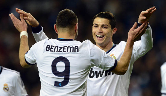 Real Madrid's Portuguese forward Cristiano Ronaldo (R) celebrates with his teammate French forward Karim Benzema after scoring during the UEFA Champions League Group D football match Real Madrid vs Ajax Amsterdam at the Santiago Bernabeu stadium in Madrid on December 4, 2012. AFP PHOTO / JAVIER SORIANO (Photo credit should read JAVIER SORIANO/AFP/Getty Images)