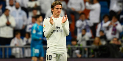 Real Madrid's Croatian midfielder Luka Modric applauds on the pitch during the Spanish League football match between Real Madrid and Rayo Vallecano at the Santiago Bernabeu stadium in Madrid on December 15, 2018. (Photo by GABRIEL BOUYS / AFP) (Photo credit should read GABRIEL BOUYS/AFP/Getty Images)