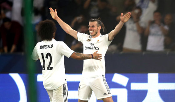 ABU DHABI, UNITED ARAB EMIRATES - DECEMBER 19: Gareth Bale of Real Madrid celebrates scoring the third goal and his hat-trick with Marcelo of Real Madrid during the FIFA Club World Cup semi-final match between Kashima Antlers and Real Madrid at Zayed Sports City Stadium on December 19, 2018 in Abu Dhabi, United Arab Emirates. (Photo by Francois Nel/Getty Images)