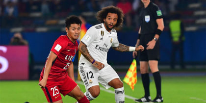 Kashima Antler's midfielder Yasushi Endo (L) marks Real Madrid's Brazilian defender Marcelo during the semi final football match of the FIFA Club World Cup 2018 tournament between Japan's Kashima Antlers and Spain's Real Madrid at the Zayed Sports City Stadium in Abu Dhabi, the capital of the United Arab Emirates, on December 19, 2018. (Photo by Giuseppe CACACE / AFP) (Photo credit should read GIUSEPPE CACACE/AFP/Getty Images)