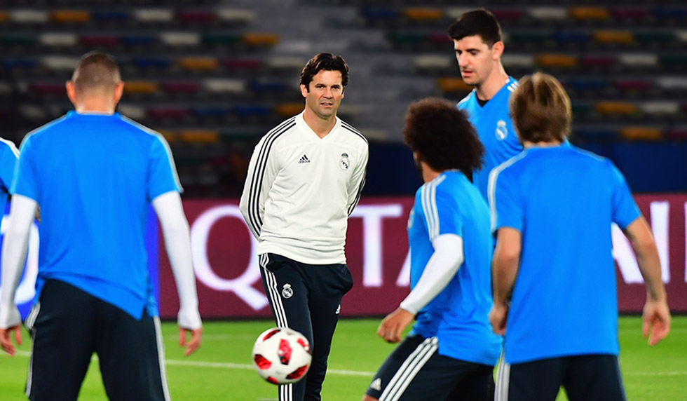 Real Madrid's Argentinian coach Santiago Solari (C-R) watches his players during a training session on the eve of the team's FIFA Club World Cup final match against Al-Ain, in the Emirati capital Abu Dhabi on December 21, 2018. (Photo by GIUSEPPE CACACE / AFP) (Photo credit should read GIUSEPPE CACACE/AFP/Getty Images)