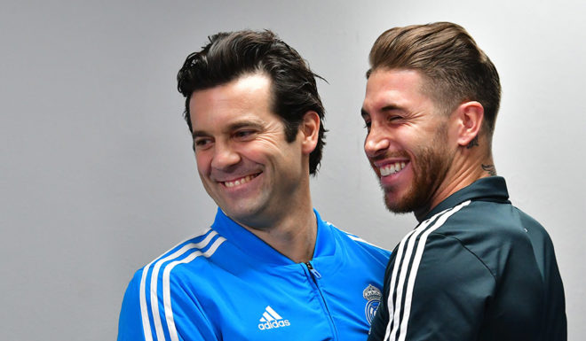 Real Madrid's Argentinian coach Santiago Solari (L) embraces his Spanish defender and captain Segio Ramos as they attend a press conference on the eve of their FIFA Club World Cup final match against Al-Ain, in the Emirati capital Abu Dhabi on December 21, 2018. (Photo by GIUSEPPE CACACE / AFP) (Photo credit should read GIUSEPPE CACACE/AFP/Getty Images)