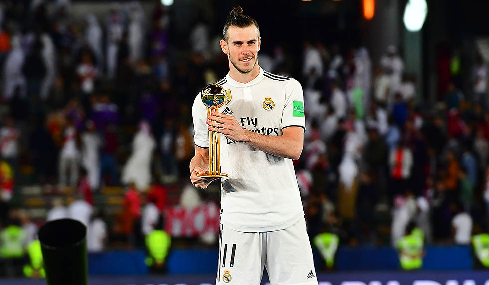 Real Madrid's Welsh forward Gareth Bale poses with the competition's most valuable player trophy after winning the FIFA Club World Cup final football match Spain's Real Madrid vs Abu Dhabi's Al Ain at the Zayed Sports City Stadium in Abu Dhabi, the capital of the United Arab Emirates, on December 22, 2018. (Photo by Giuseppe CACACE / AFP) (Photo credit should read GIUSEPPE CACACE/AFP/Getty Images)