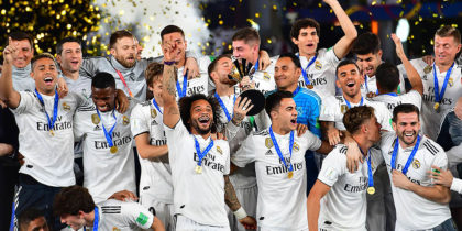 Real Madrid's players celebrate with the trophy after winning the FIFA Club World Cup final football match Spain's Real Madrid vs Abu Dhabi's Al Ain at the Zayed Sports City Stadium in Abu Dhabi, the capital of the United Arab Emirates, on December 22, 2018. (Photo by Giuseppe CACACE / AFP) (Photo credit should read GIUSEPPE CACACE/AFP/Getty Images)