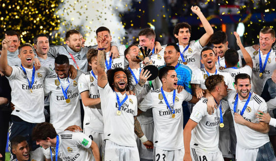 Real Madrid's players celebrate with the trophy after winning the FIFA Club World Cup final football match Spain's Real Madrid vs Abu Dhabi's Al Ain at the Zayed Sports City Stadium in Abu Dhabi, the capital of the United Arab Emirates, on December 22, 2018. (Photo by Giuseppe CACACE / AFP) (Photo credit should read GIUSEPPE CACACE/AFP/Getty Images)