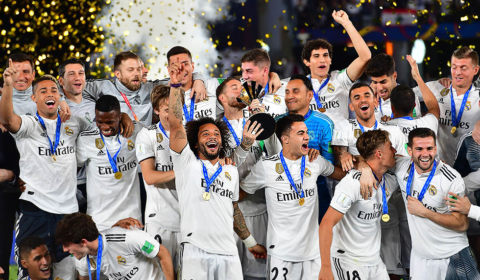 Real Madrid's players celebrate with the trophy after winning the FIFA Club World Cup final football match Spain's Real Madrid vs Abu Dhabi's Al Ain at the Zayed Sports City Stadium in Abu Dhabi, the capital of the United Arab Emirates, on December 22, 2018. (Photo by Giuseppe CACACE / AFP) (Photo credit should read GIUSEPPE CACACE/AFP/Getty Images)