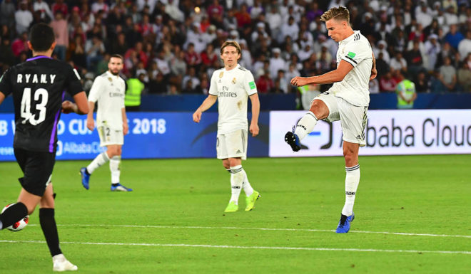 Real Madrid's Spanish midfielder Marcos Llorente (R) kicks and scores during the FIFA Club World Cup final football match Spain's Real Madrid vs Abu Dhabi's Al Ain at the Zayed Sports City Stadium in Abu Dhabi, the capital of the United Arab Emirates, on December 22, 2018. (Photo by Giuseppe CACACE / AFP) (Photo credit should read GIUSEPPE CACACE/AFP/Getty Images)