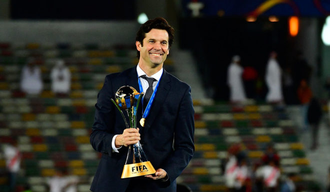 Real Madrid's Argentinian coach Santiago Solari celebrates with the trophy after winning the FIFA Club World Cup final football match Spain's Real Madrid vs Abu Dhabi's Al Ain at the Zayed Sports City Stadium in Abu Dhabi, the capital of the United Arab Emirates, on December 22, 2018. (Photo by Giuseppe CACACE / AFP) (Photo credit should read GIUSEPPE CACACE/AFP/Getty Images)