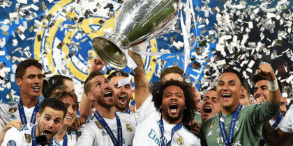TOPSHOT - Real Madrid's Brazilian defender Marcelo (C) lifts the trophy after winning the UEFA Champions League final football match between Liverpool and Real Madrid at the Olympic Stadium in Kiev, Ukraine on May 26, 2018. - Real Madrid defeated Liverpool 3-1. (Photo by LLUIS GENE / AFP) (Photo credit should read LLUIS GENE/AFP/Getty Images)