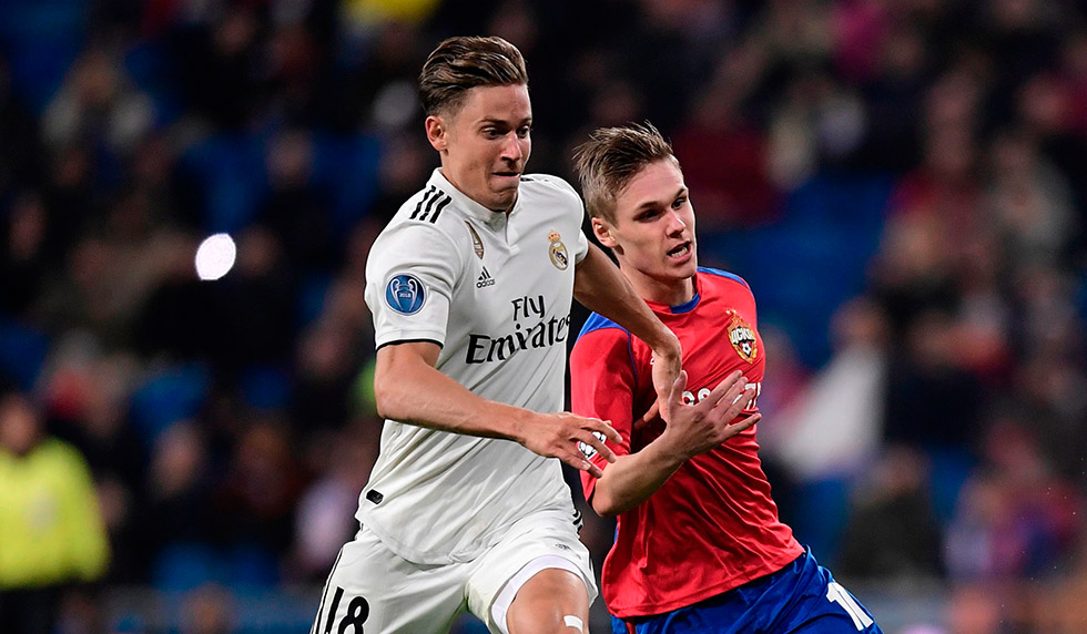 Real Madrid's Spanish miedfieder Marcos Llorente (L) vies with CSKA Moscow's Icelandic midfielder Arnor Sigurdsson during the UEFA Champions League group G football match between Real Madrid CF and CSKA Moscow at the Santiago Bernabeu stadium in Madrid on December 12, 2018. (Photo by JAVIER SORIANO / AFP) (Photo credit should read JAVIER SORIANO/AFP/Getty Images)