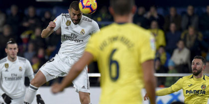 Real Madrid's French forward Karim Benzema heads the ball to score a goal during the Spanish League football match between Villarreal CF and Real Madrid CF at La Ceramica stadium in Vila-real on January 3, 2019. (Photo by JOSE JORDAN / AFP) (Photo credit should read JOSE JORDAN/AFP/Getty Images)