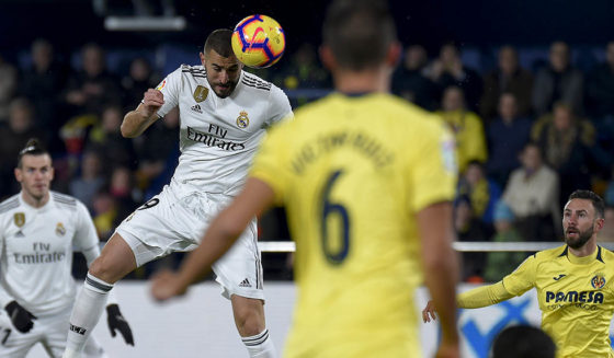 Real Madrid's French forward Karim Benzema heads the ball to score a goal during the Spanish League football match between Villarreal CF and Real Madrid CF at La Ceramica stadium in Vila-real on January 3, 2019. (Photo by JOSE JORDAN / AFP) (Photo credit should read JOSE JORDAN/AFP/Getty Images)