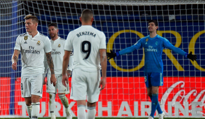 Real Madrid players react to Villarreal's equalizer during the Spanish League football match between Villarreal CF and Real Madrid CF at La Ceramica stadium in Vila-real on January 3, 2019. (Photo by JOSE JORDAN / AFP) (Photo credit should read JOSE JORDAN/AFP/Getty Images)
