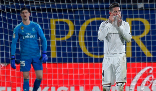 Real Madrid's Spanish defender Sergio Ramos (R) reacts to Villarreal's second goal during the Spanish League football match between Villarreal CF and Real Madrid CF at La Ceramica stadium in Vila-real on January 3, 2019. (Photo by JOSE JORDAN / AFP) (Photo credit should read JOSE JORDAN/AFP/Getty Images)